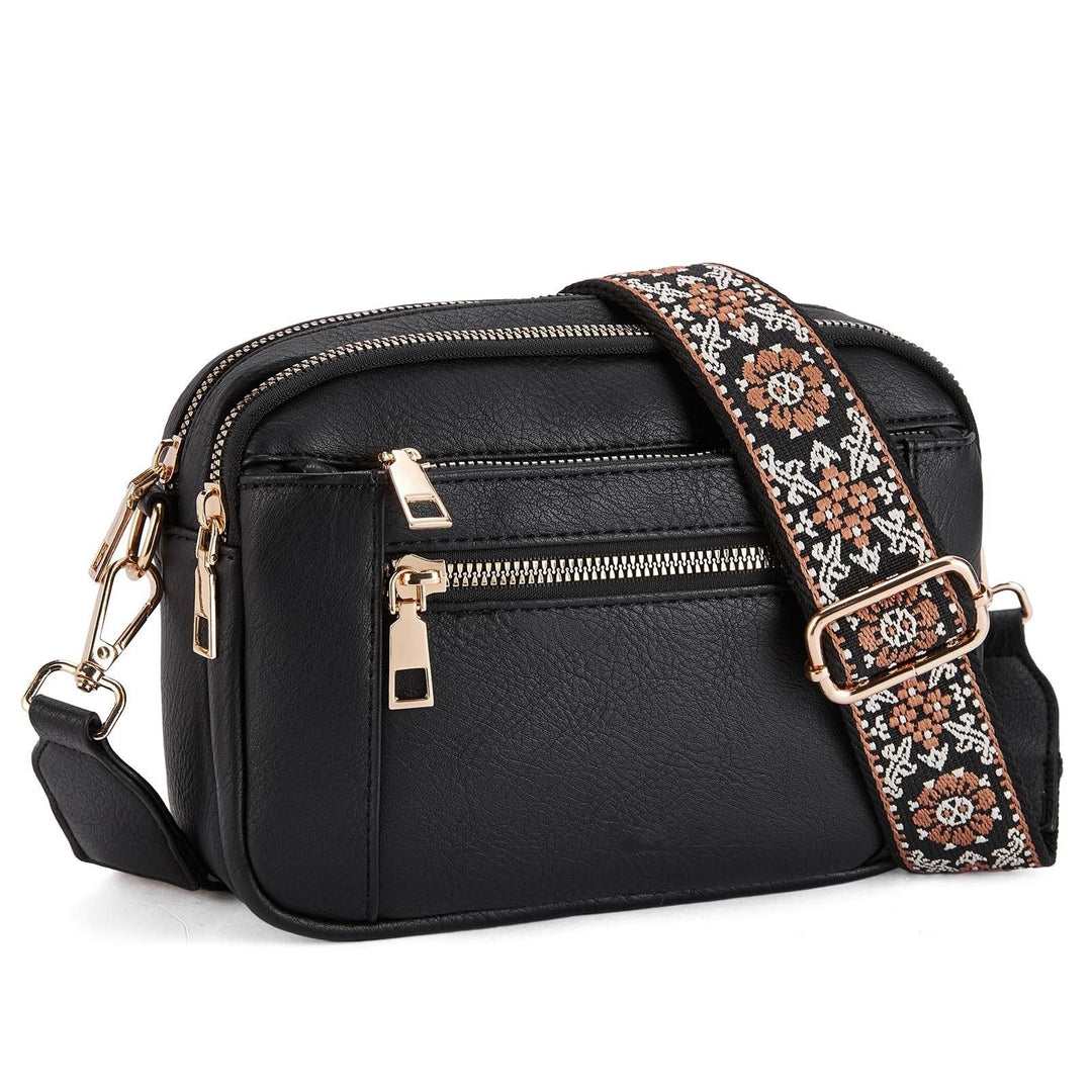 Kobiecza torebka crossbody z wieloma zamkami i nadrukowanym paskiem